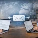 International PhD student emailing a university professor about supervision while the professor reviews and replies, illustrating first contact with potential PhD supervisors.